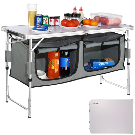 Cuisine camping table with drinks, snacks, and fruits, perfect for outdoor cooking and meal prep.